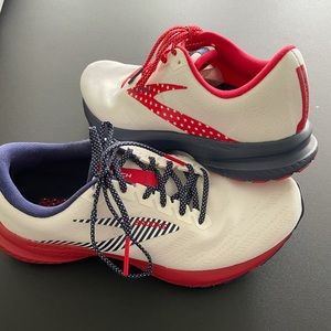 Women’s Size 8 Brooks red/white/blue running shoe.
